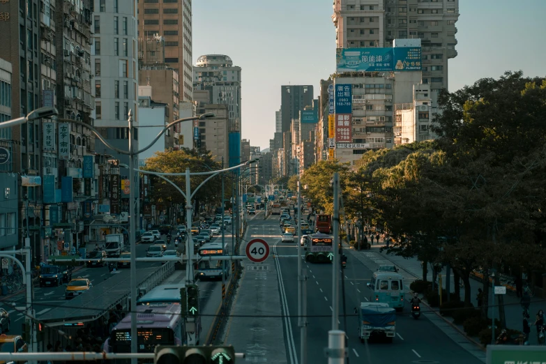 a city street with a car and bus driving