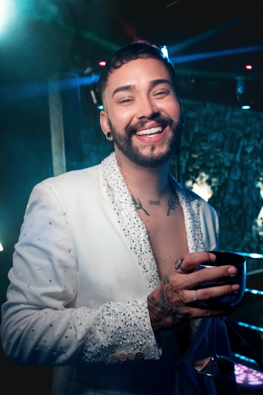 a person in a white shirt and tie and smiling