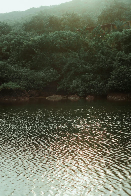 a small boat floating in the middle of a lake