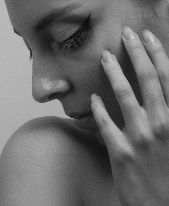 black and white po of a woman with her eyes closed