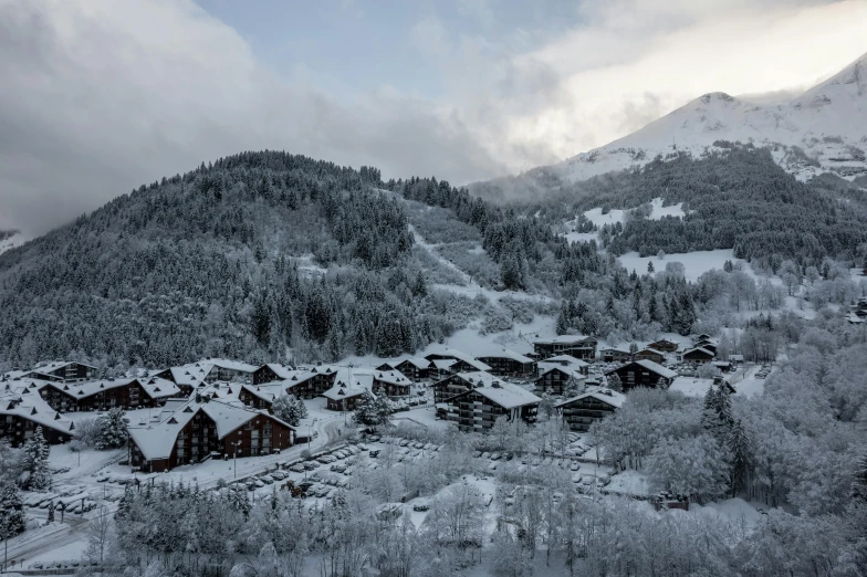 an image of snow covered mountain side town