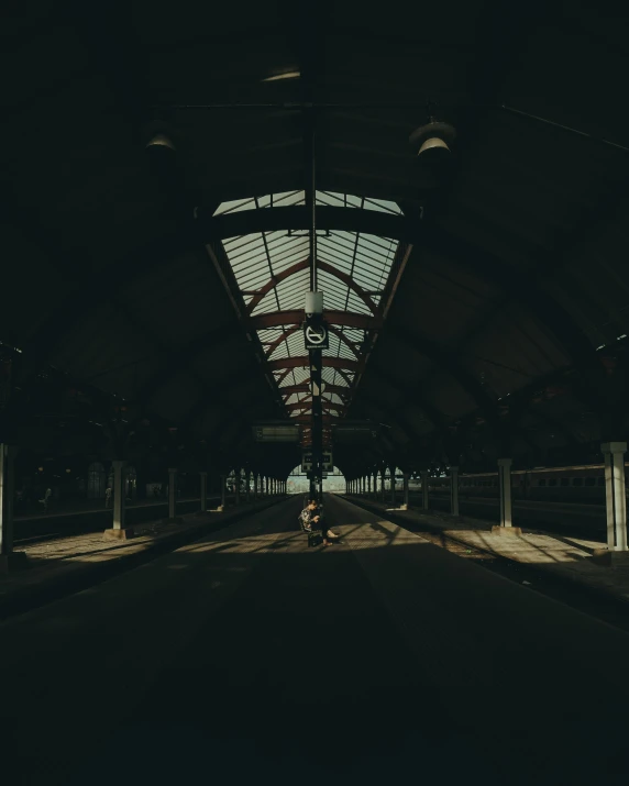 a motorcycle is driving down a dark hallway