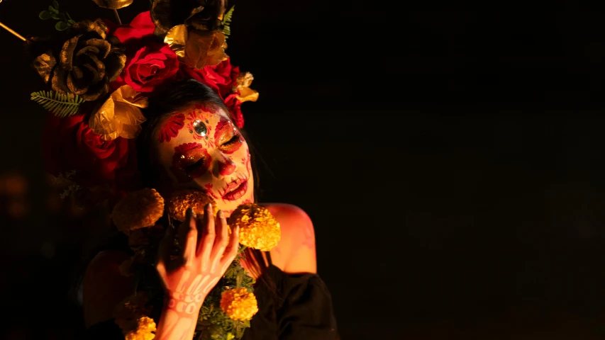 a woman wearing makeup and flowers in her hair