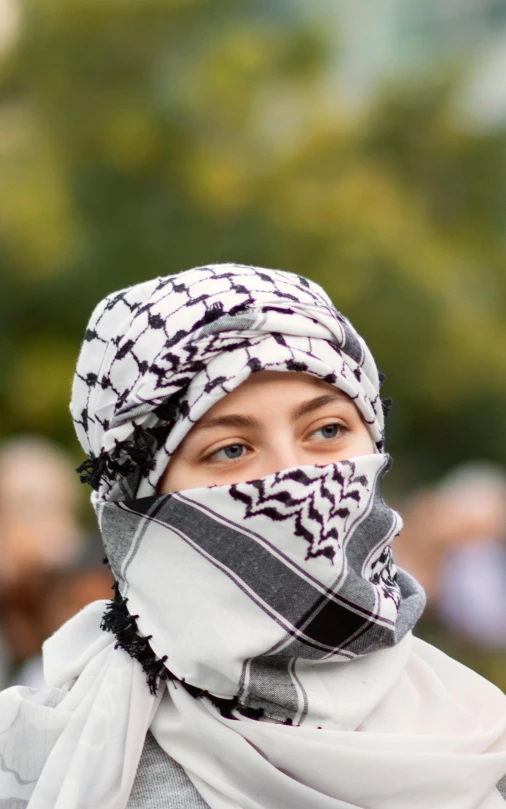 a woman with an elaborate scarf on her head