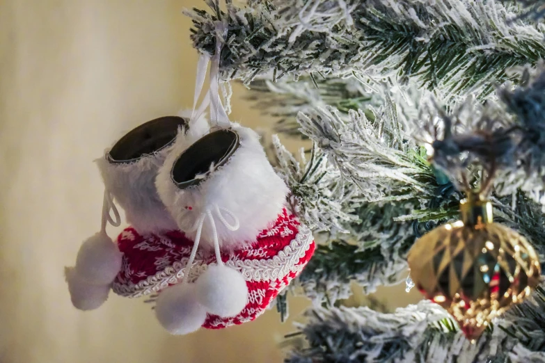 a christmas ornament hanging from a tree