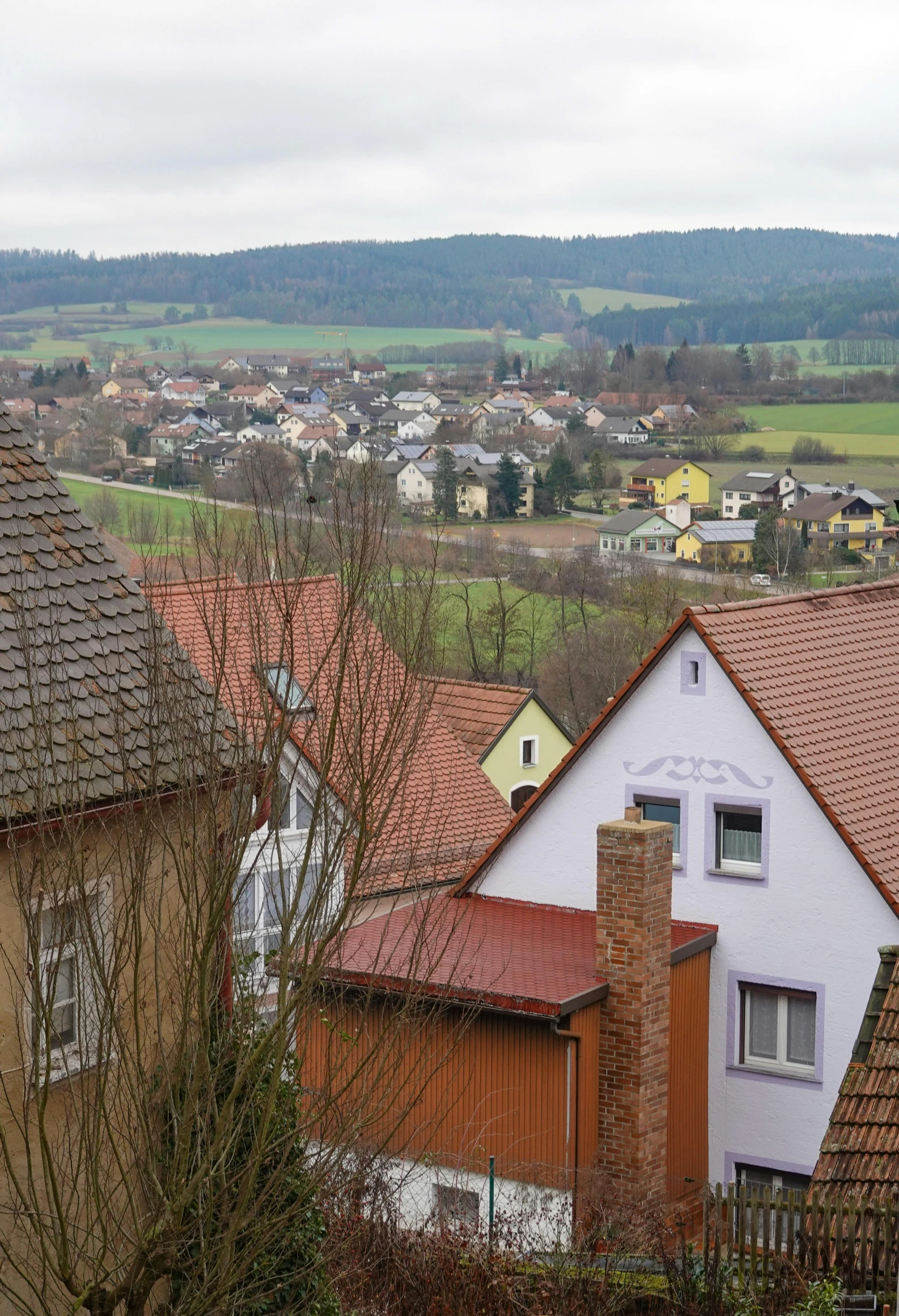 view over houses and countryside from a hill