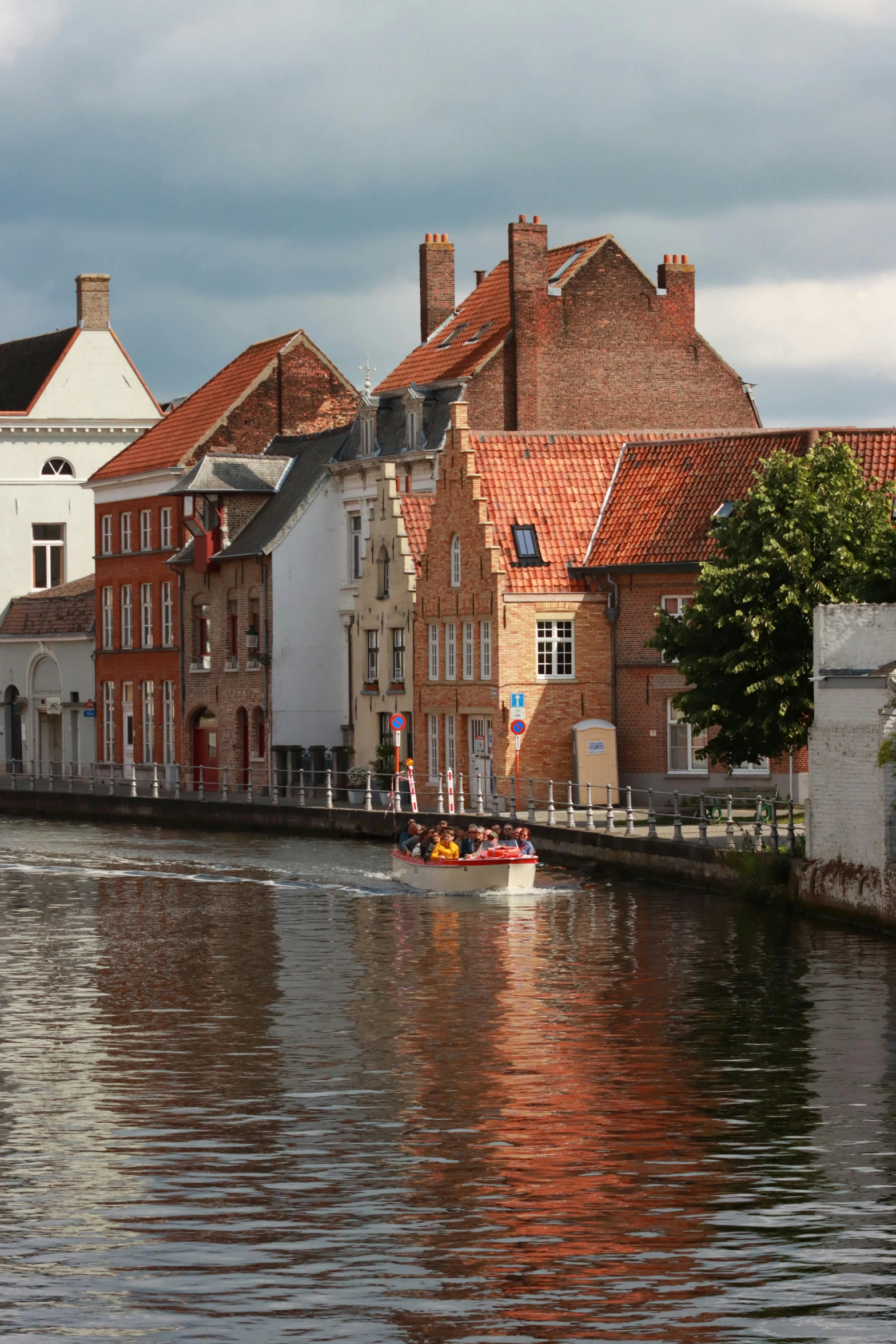 houses along the water with a boat on it