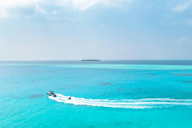 the boats are in a small body of blue water