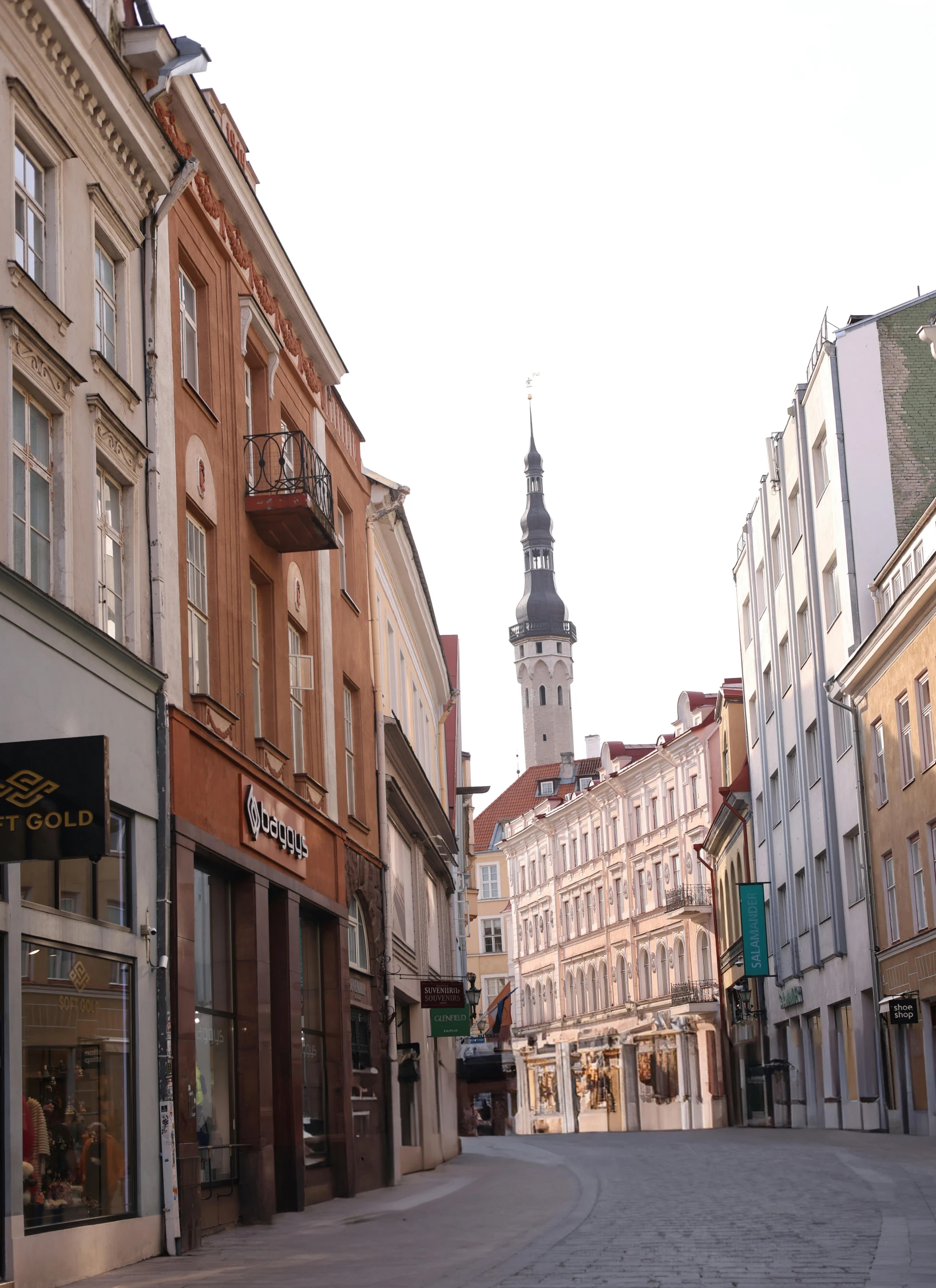 a street view looking down at buildings and a clock tower