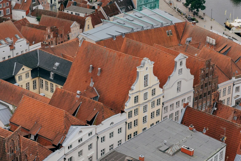 aerial view of red and white roofs, church and buildings