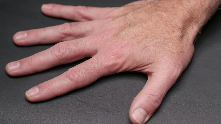 a close up of the fingers of a person