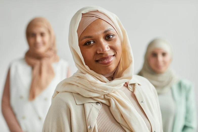 three woman wearing scarves and headscarves