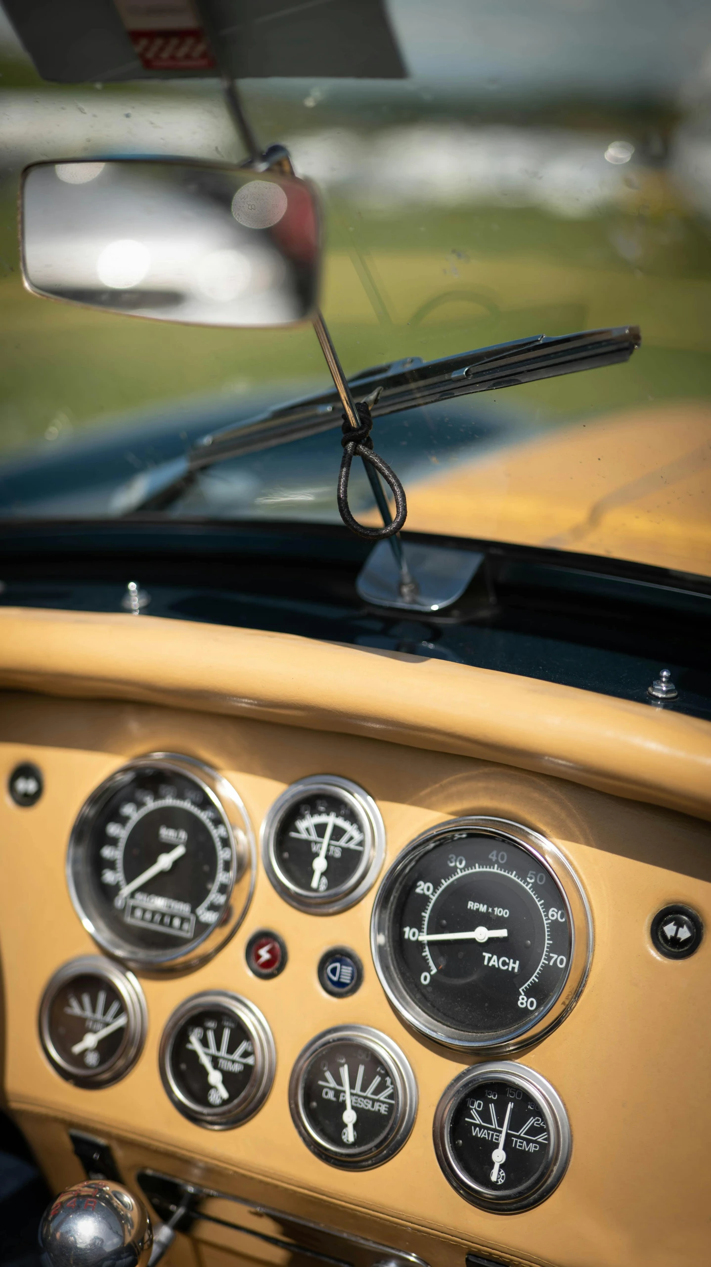 dashboard, gauges and instruments on the dashboard of a vintage car