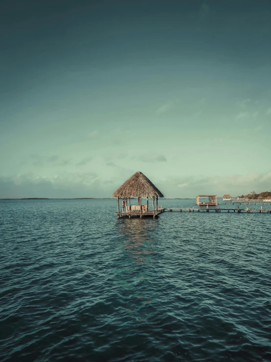 a house on the water surrounded by houses