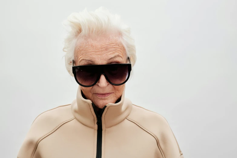 an old lady with white hair wearing black sunglasses