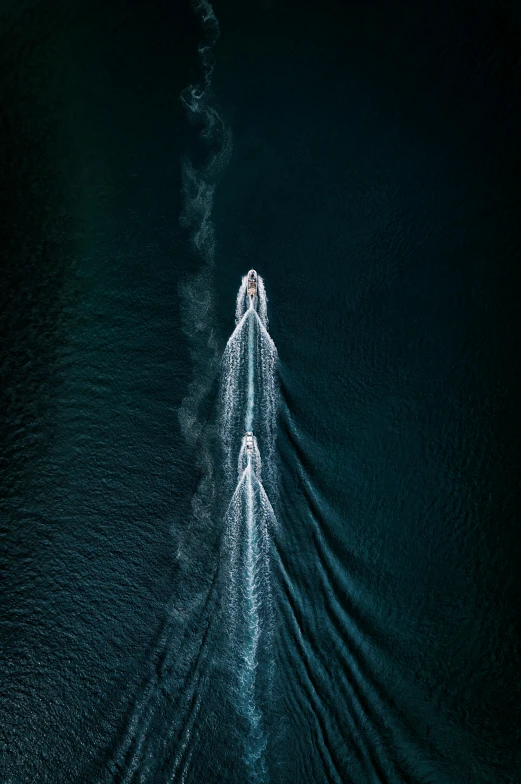 a man riding a boat across a body of water