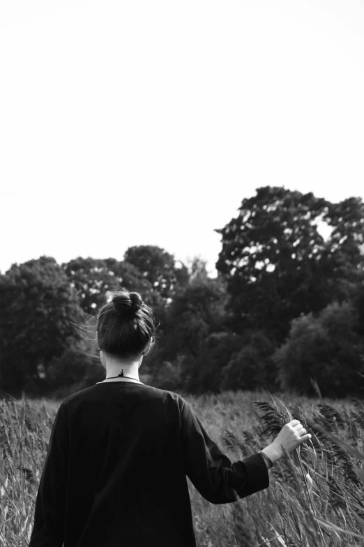 a black and white po of a woman holding a frisbee