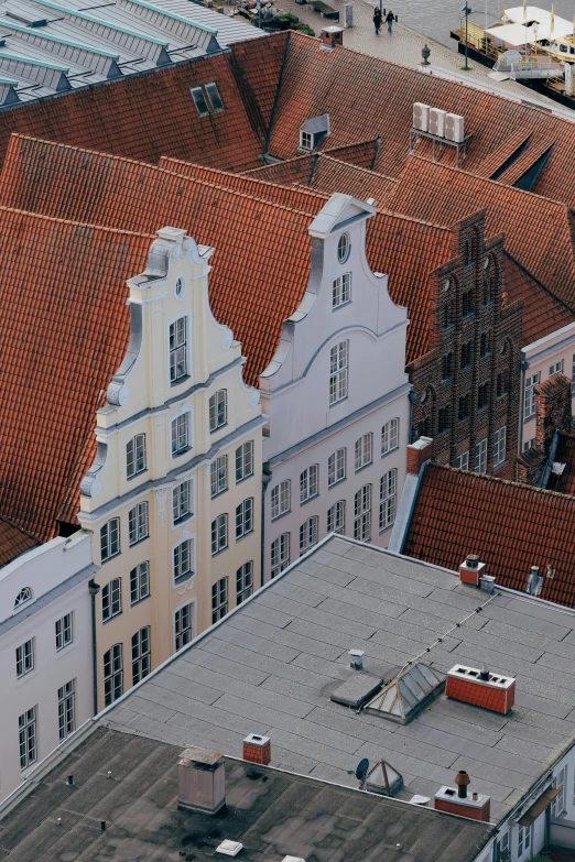 several roofs and windows on an old city block