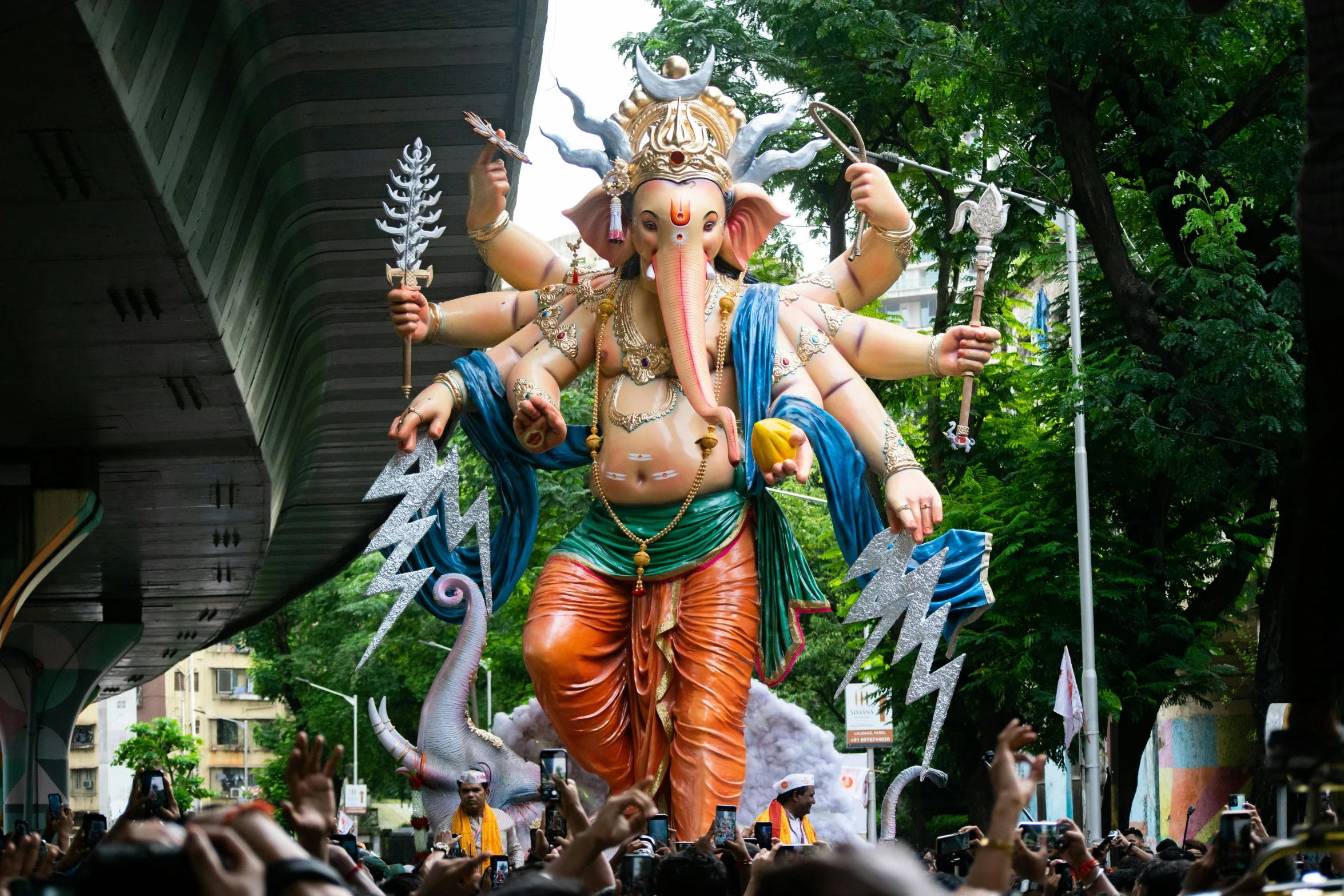 the float features a man riding on an elephant