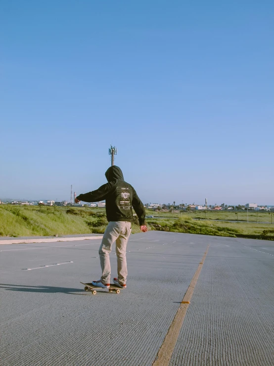 a skate boarder moves down the road with no wheels