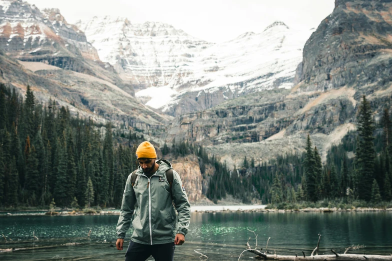 a man standing in the middle of a body of water