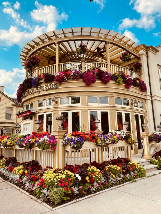 an image of a building with flowers everywhere