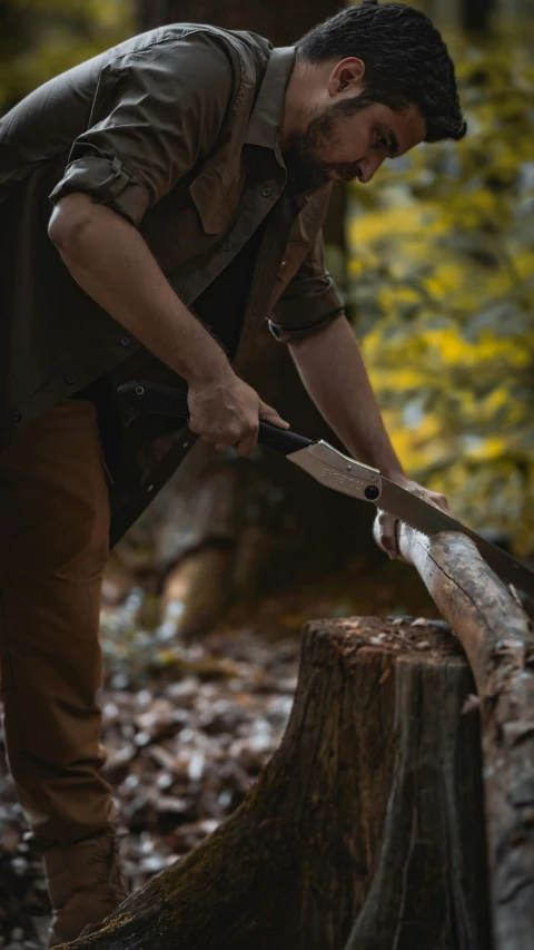 a man wearing a vest holding a large knife