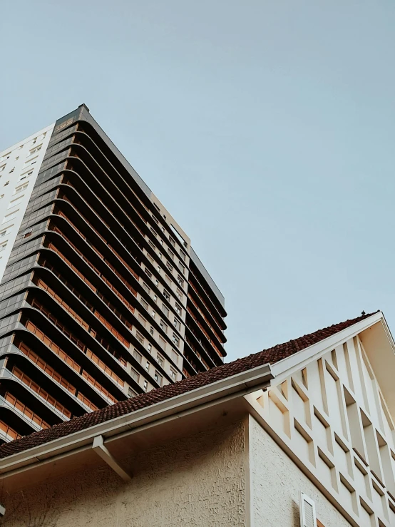 a building sits against the sky with its verticaled and angled sides