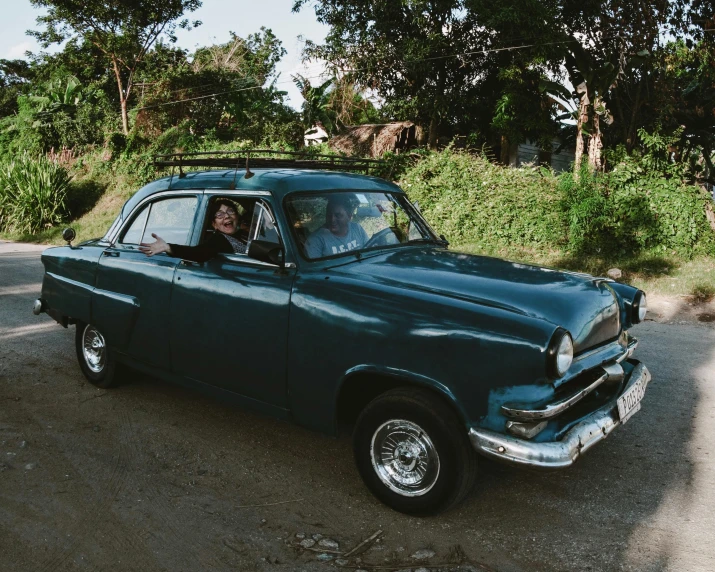 a woman in a car driving down the road