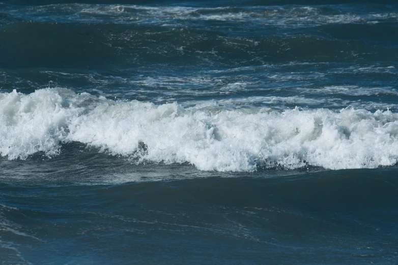 two large white and black waves next to each other