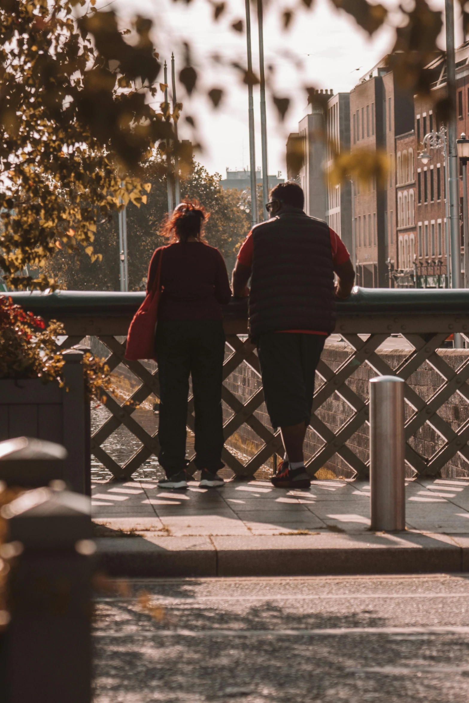 two people who are standing next to each other