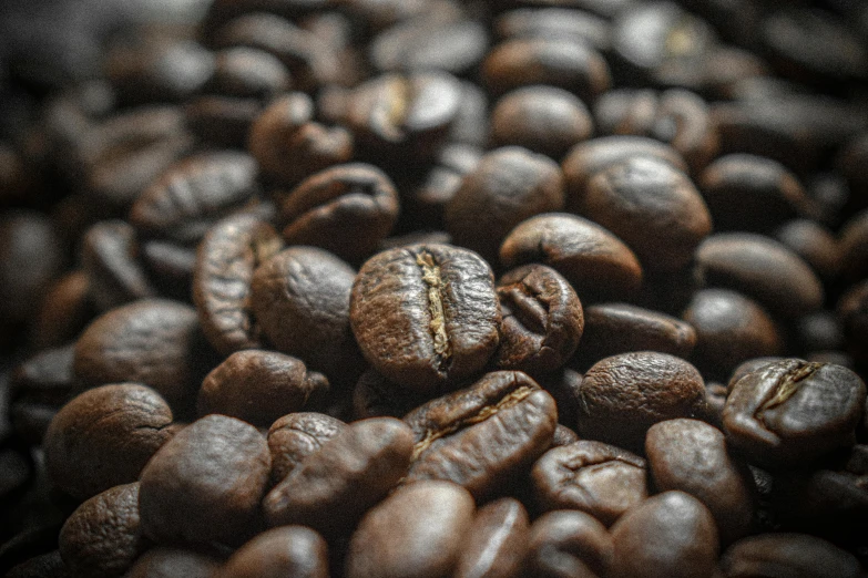 a pile of coffee beans that are filled with some food