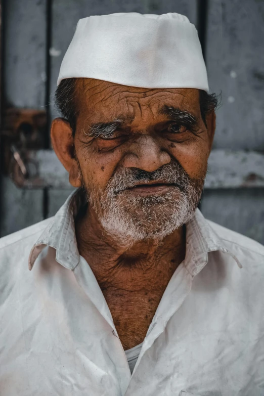 a man with a white hat and white shirt