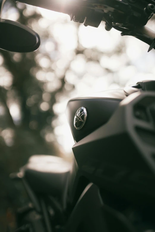 a close up of a motorcycle with the headlights on