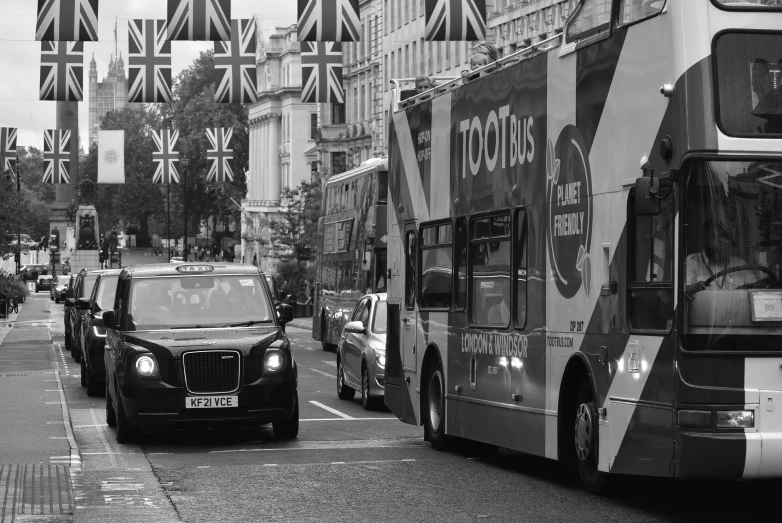 a double decker bus on a street with cars