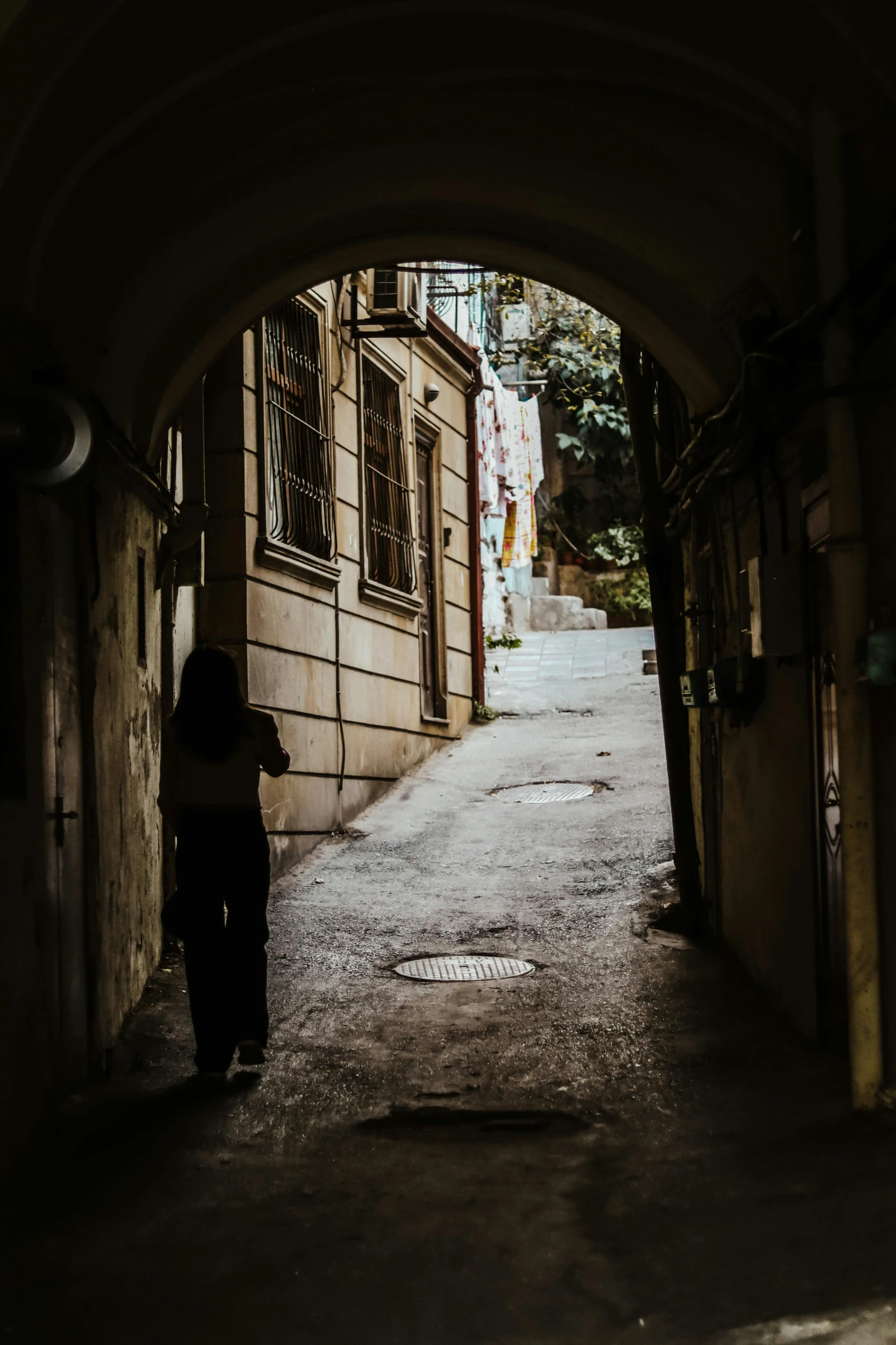 a person that is standing up in an arch