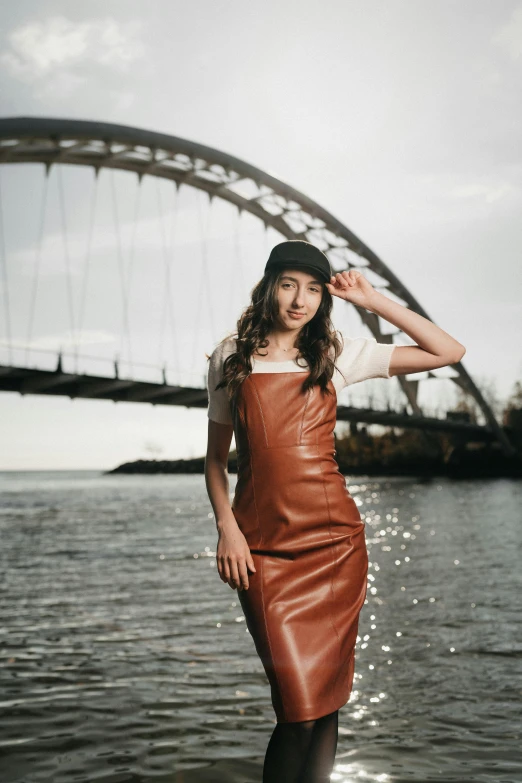 a woman standing on the edge of a body of water