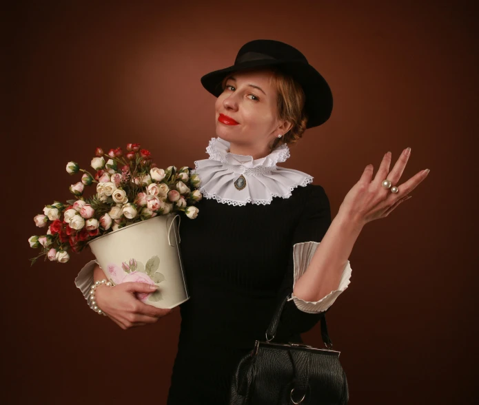 a young woman is holding flowers in a bucket