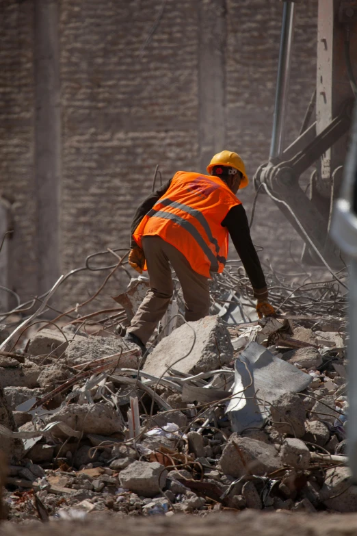 a person walking through debris on a construction site