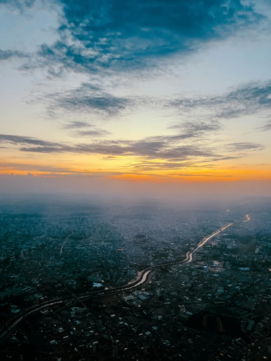 aerial view of city skyline with fog and clouds