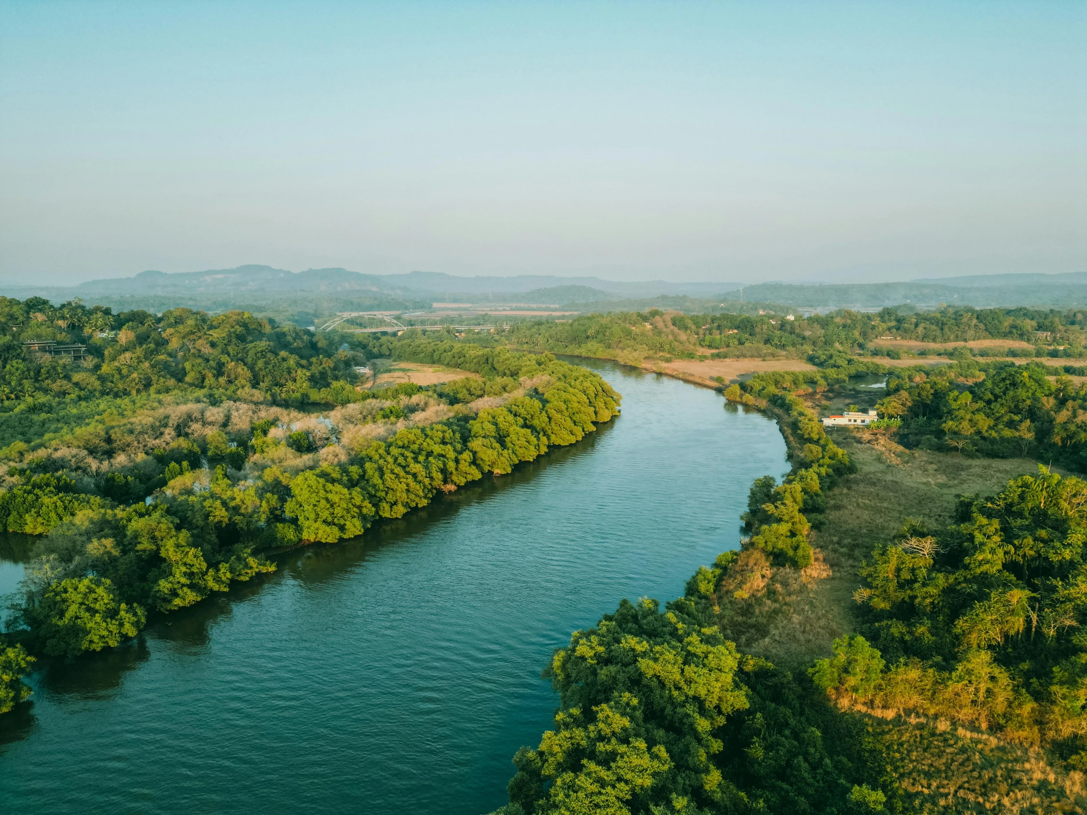 an aerial view of the river and surrounding a city