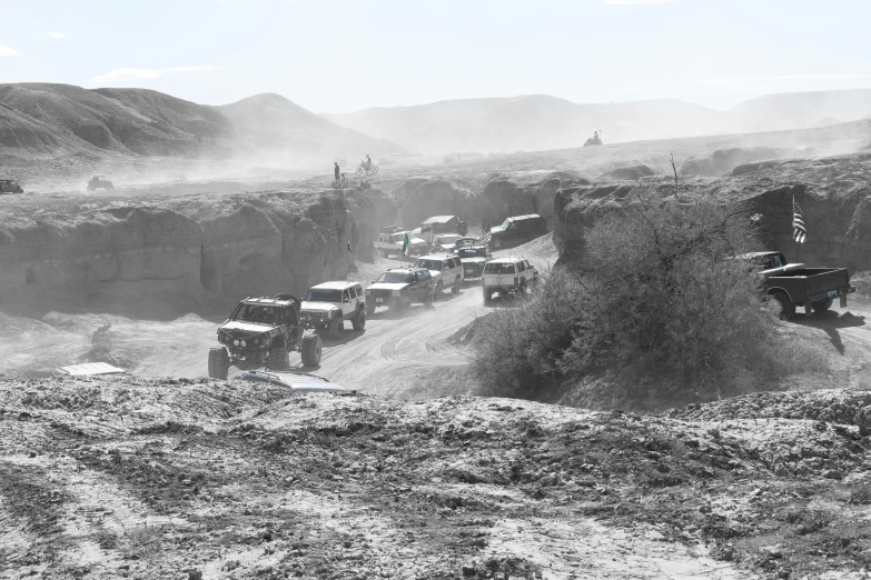 a group of cars that are stuck in the dirt