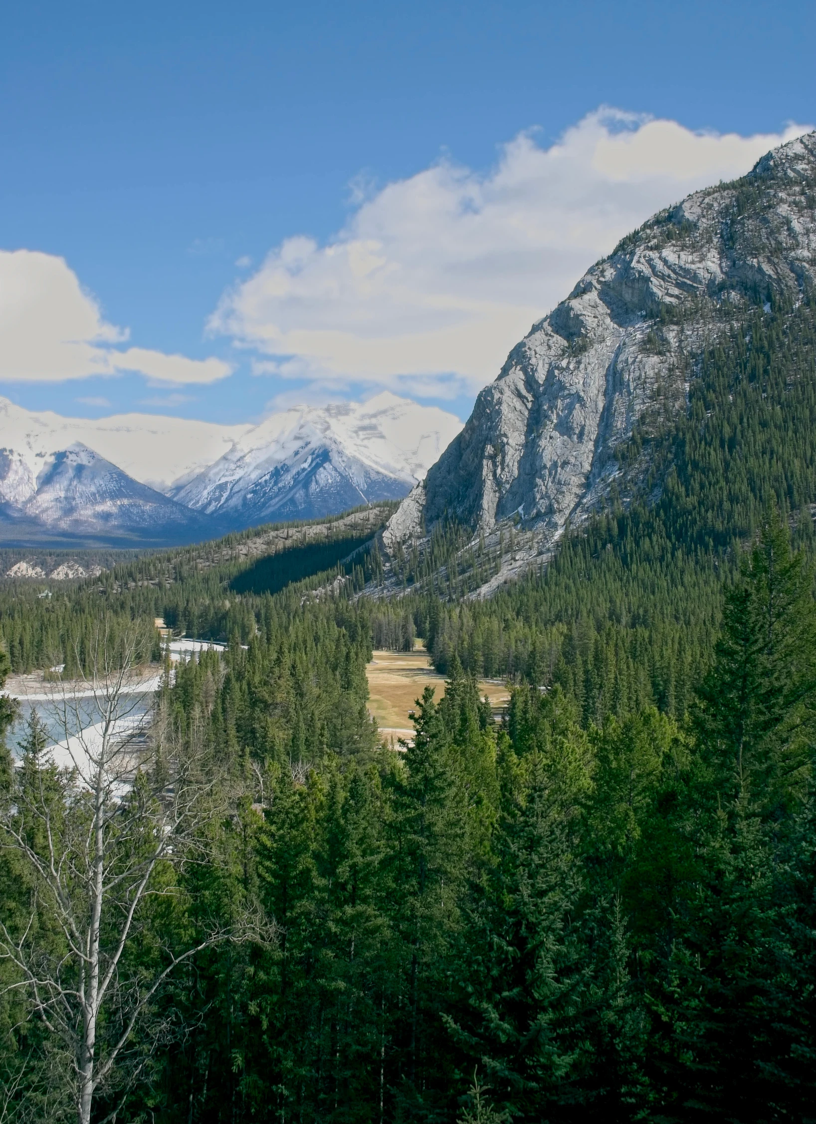 the mountains with snow are in the background