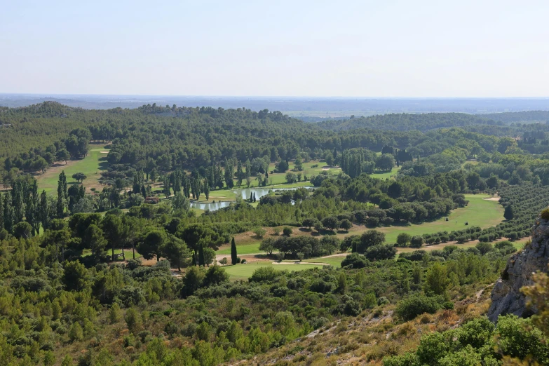 a view from a hill on a scenic golf course