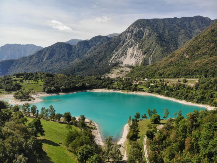 an aerial s of a beautiful blue lake surrounded by green trees