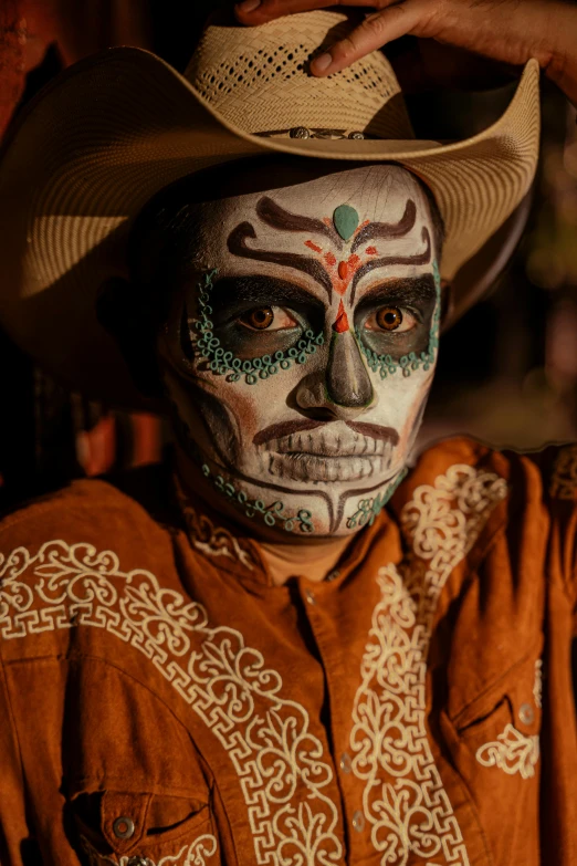 a man with a face painted like a skeleton