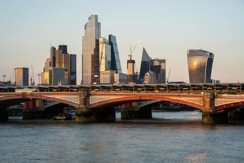 a river that is full of boats and tall buildings