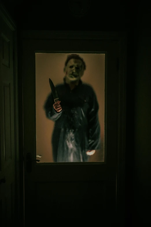 a person in a dark room holding a gun