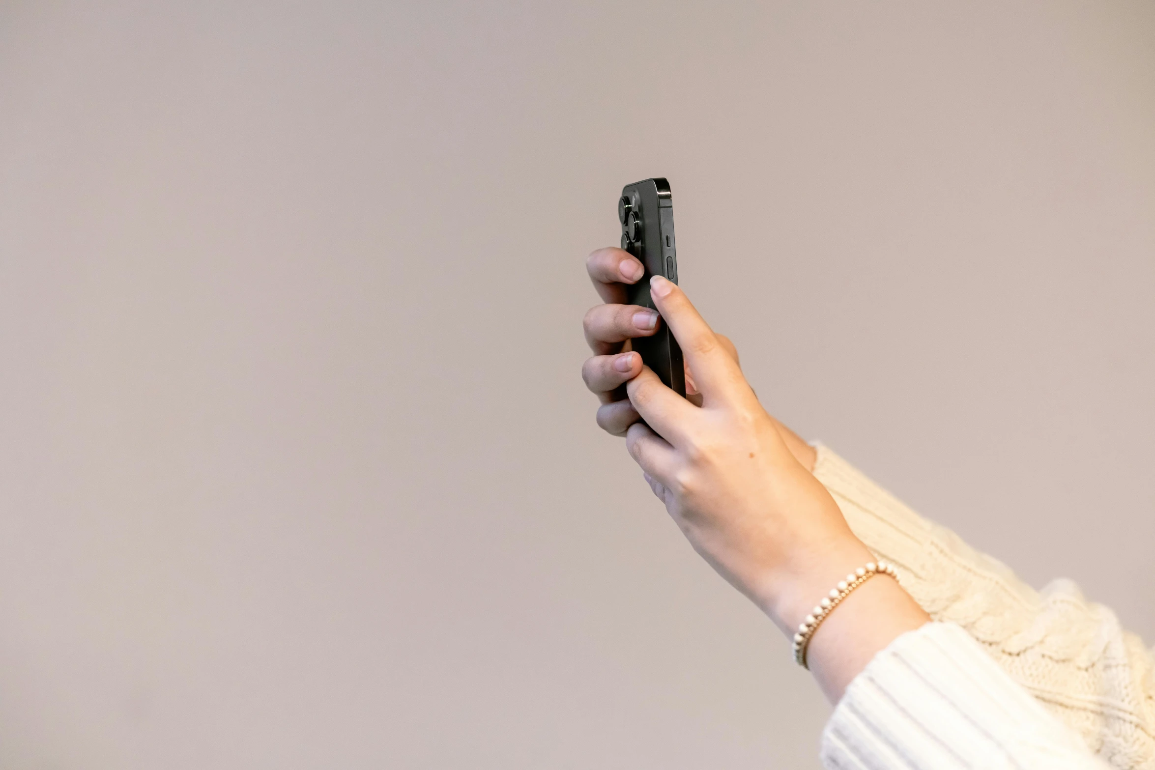 a close up of a person holding a cell phone