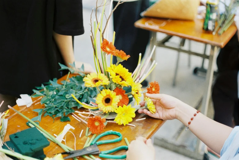 someone is making a bouquet on top of a table